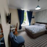 Room-3 1st floor with carpet, a double bed, smart en-suite and a hint of the ocean at the Old School Bed and Breakfast Carmarthen